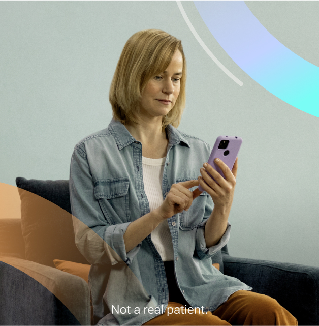 Woman sitting on a chair using Rejoyn on her smartphone